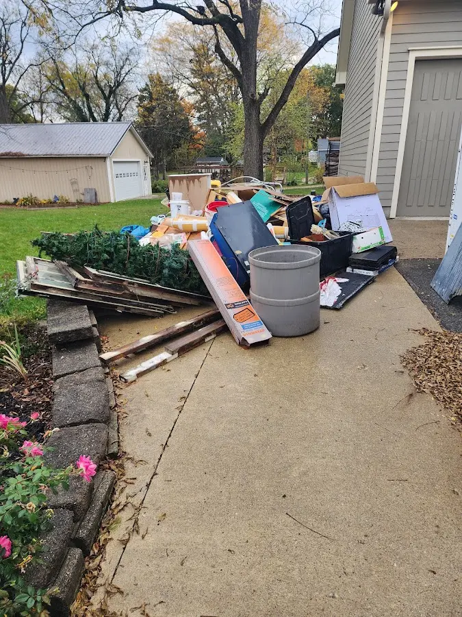 Dumpster being loaded with debris for 10 Yard Dumpster Rental in Birdsboro
